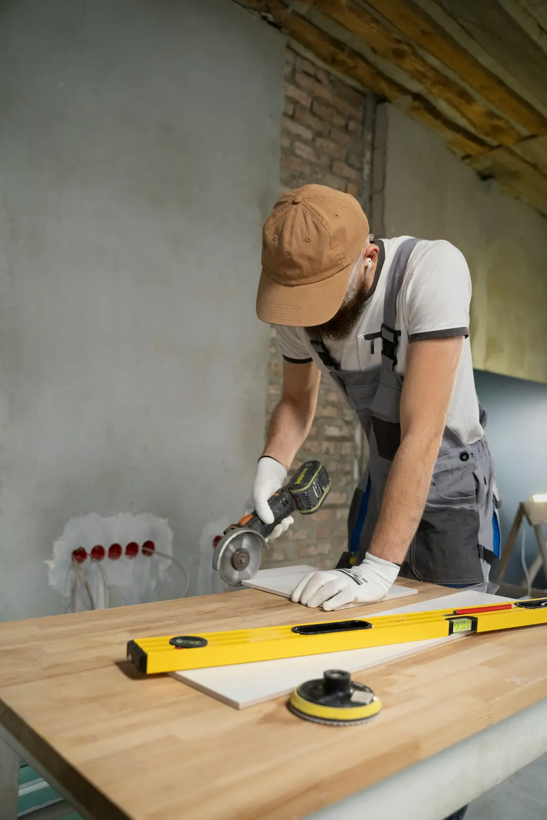 Tradesperson in a hard hat working on a jobsite