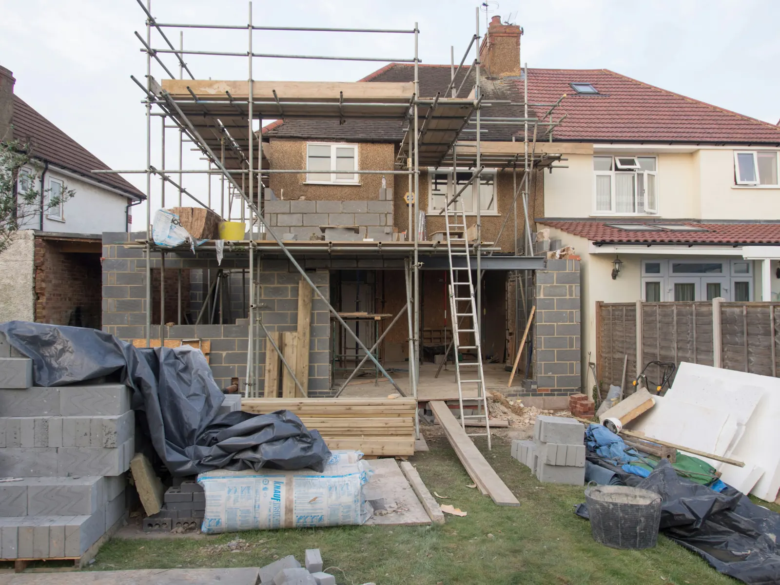 Home under construction with scaffolding